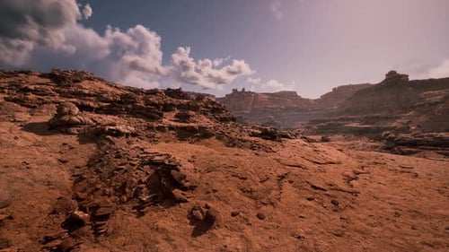 Expansive Rock Formations Under a Bright Sky in a Remote Desert Landscape