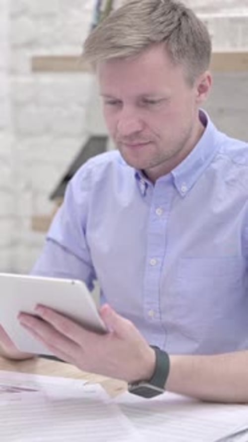 Businessman Using Tablet, Vertical Video