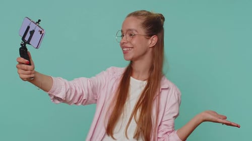 Girl Traveler Blogger Taking Selfie on Mobile Phone Selfie Stick Communicating Video Call Online