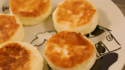 Delicious Golden Cakes on Plate Close Up