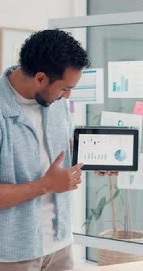 Businessman, tablet screen and graphs in meeting for presentation, campaign performance or trends