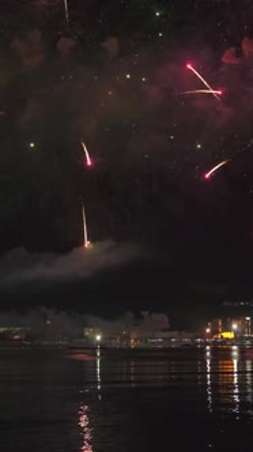 Fireworks with colorful lights over sea