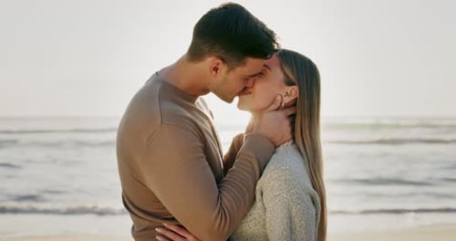 Kiss, couple and travel, beach and love with bonding, romantic date outdoor