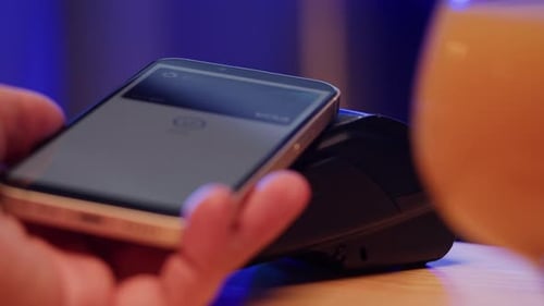 Paying with Smartphone Closeup Cashless Shopping in Restaurant or Cafe Touchfree and Contactless