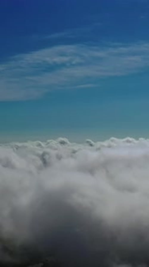 Aerial View of Fluffy White Clouds and Blue Sky