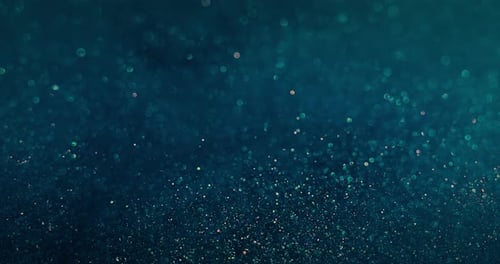 Sparkling Glitter Bokeh Lights on Teal Background