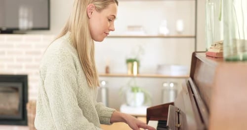 Woman Plays Piano at Home in Natural Light