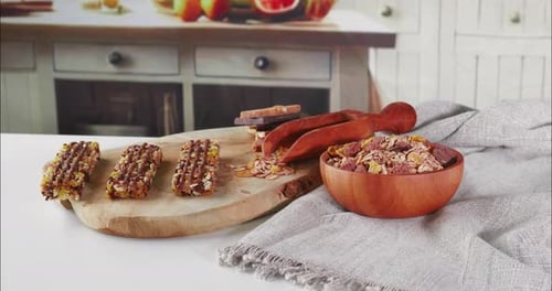 Camera Pushes In on Granola Bars and Cereal in Rustic Kitchen