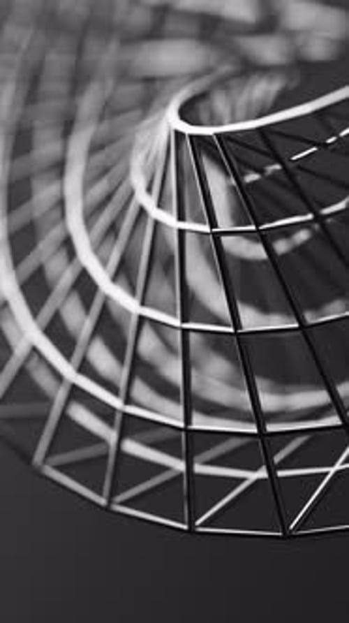 Chrome mesh Mobius loop spinning in a continuous 3D cycle.