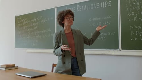 Teacher Explaining Math in Classroom