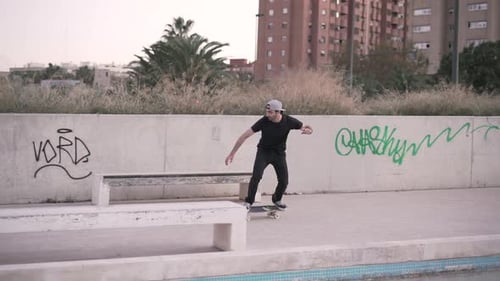 Man Skateboarding in City Skate Park