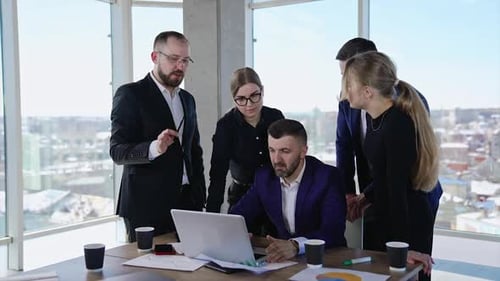 Collaboration and teamwork in the office atmosphere.