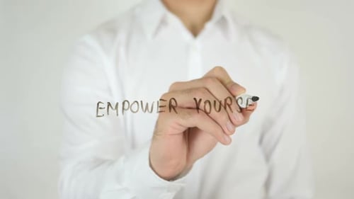 Empower Yourself Phrase Being Written on Glass