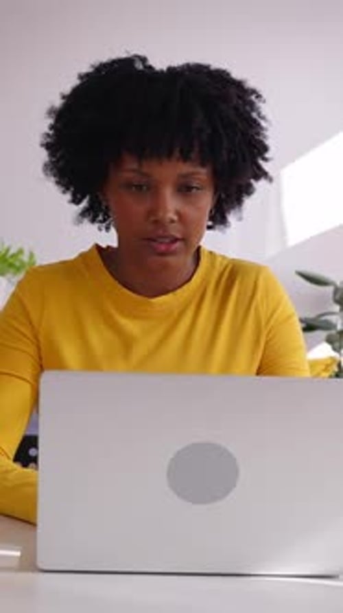 Smiling Latin American Freelancer Woman Working From Home Using Laptop