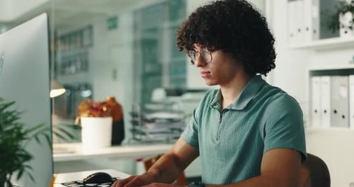 Thinking, computer and programming in office, man and IT specialist with glasses