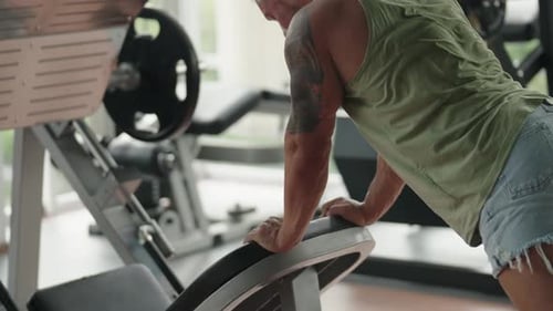 Man Doing Pushups in a Gym Focused on Fitness Training