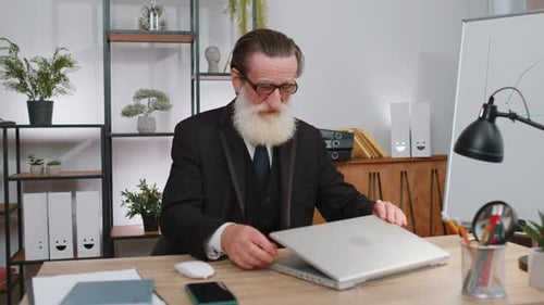 Senior Business Man Freelancer at Office Start Working on Laptop Computer Sends Online Messages