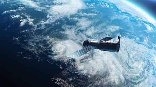Spoutnik ou vaisseau spatial en orbite autour de la planète Terre. le concept de technologie et d'espace