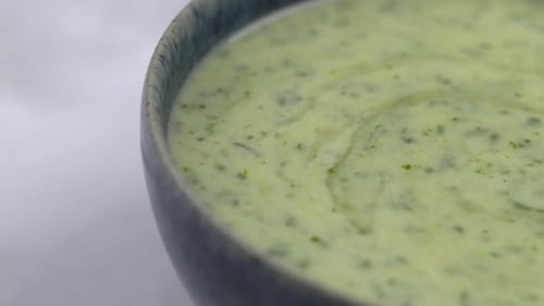 Close Up of Green Cream Soup in Bowl