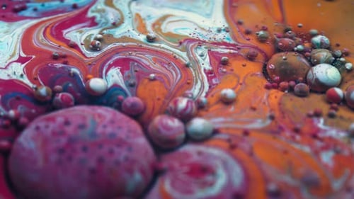 Colorful abstract background of liquid colors and bubbles in macro