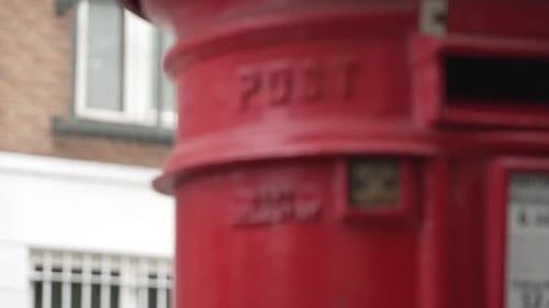 Red Post box with 'Post' written on it in London