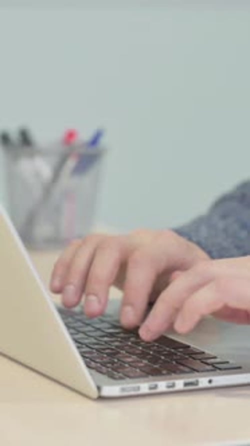 Close up of Male Hands Typing on Laptop, vertical video