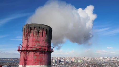 Aerial view of the pipe of the factory smoking and polluting the environment