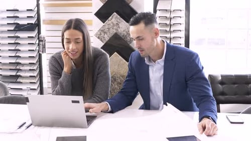 Interior Designers Working on Laptop in Showroom Office Adult