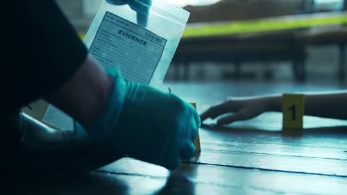 Bullet Being Collected as Evidence at Crime Scene