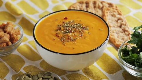 Creamy Orange Soup with Croutons and Fresh Herbs