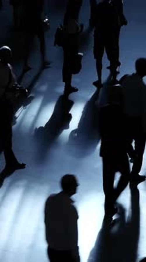 Silhouettes of Many People Walking at Night