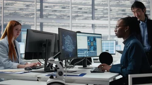 Senior Manager and Woman Using AI to Optimize Microchip Production