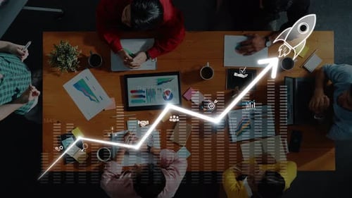 Business Team Meeting with Trend Analysis, Growth Graph, and Rocket Concept, Aerial View of Collabor