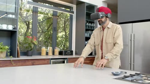 Man Wearing VR Headset Interacting in Kitchen