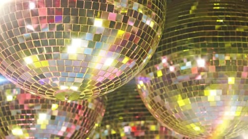 Sparkling Disco Balls Reflecting Light in a Dance Club