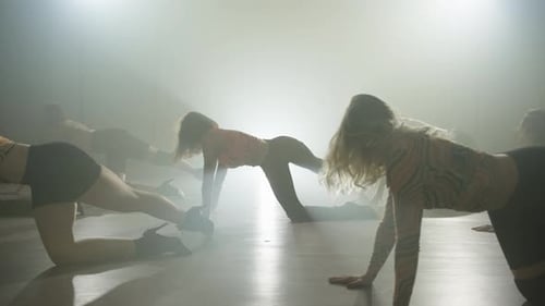Women Performing Rehearsal Dance Routine in Foggy Studio