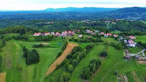 Valley with Fields Meadows Agricultural Farms Forests and Houses