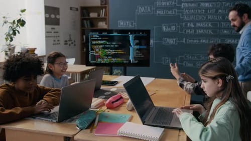 Children Learning Computer Skills with Their Teacher