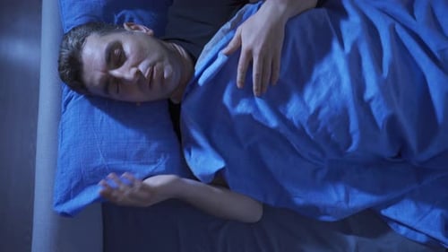 Not being able to sleep. Middle-aged man having trouble sleeping at night.
