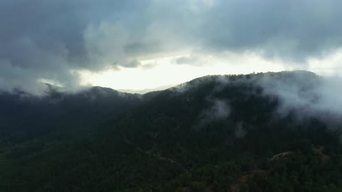 Moody Mountains Shrouded in Ethereal Fog and Clouds
