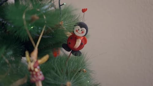 Senior Adult Decorates Christmas Tree with Ornaments