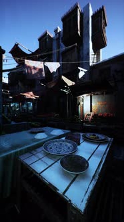Table With Plates in Front of a Building