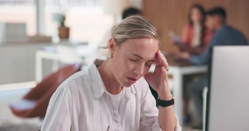 Frustrated, woman and headache with stress in office for mistake, deadline or pressure