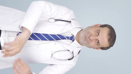 Confident Doctor Gesturing with Index Finger