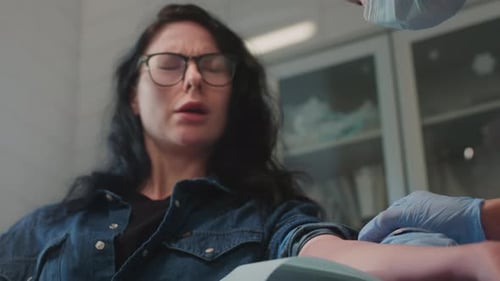 Adult Woman Receiving Injection in Doctor's Office