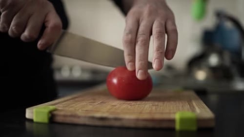 Cutting Tomato with a Sharp Knife — Fresh Vegetable Preparation