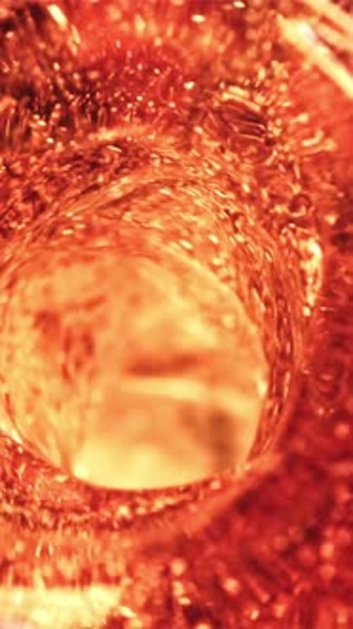 Fond macro de Whirlpool of Whiskey filmé sur une caméra haute vitesse à 1000 images par seconde