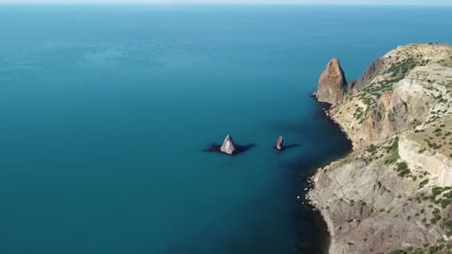 Aerial Panoramic View of Seascape with Crystal Clear Azure Sea and Rocky Shores
