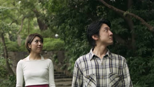 Happy Couple Stroll Through Japanese Garden