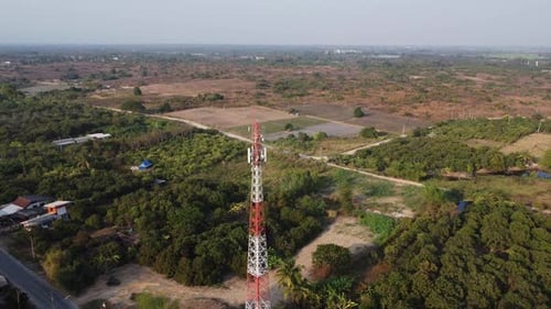 Transmission tower or pylon in aerial view. Telephone pole against rural landscape.